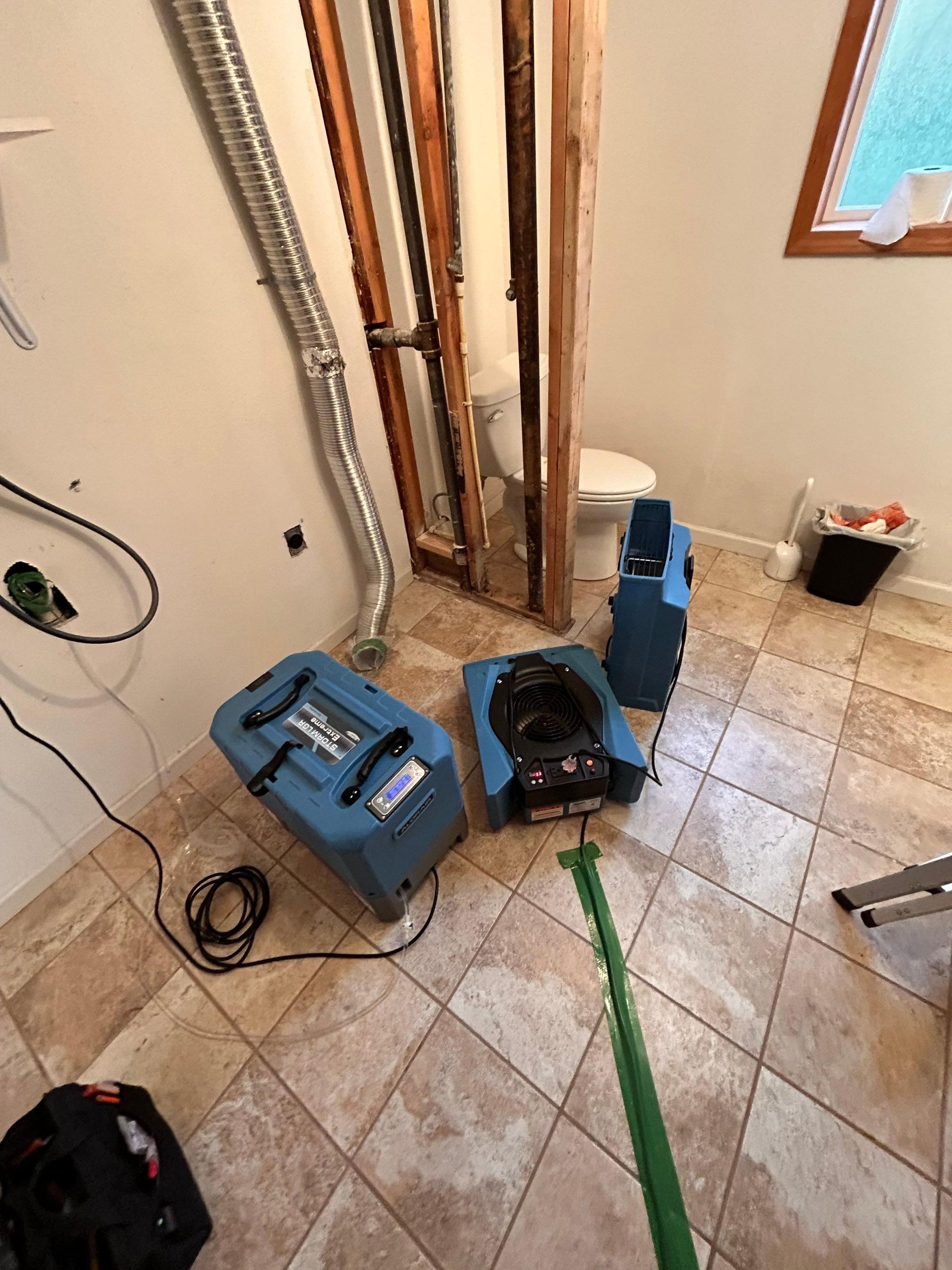 Air movers and dehumidifiers running during the first 24 hours of a water damage response
